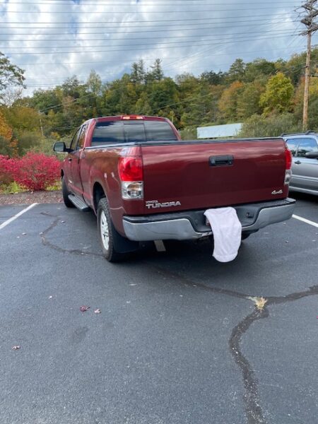 A Maroon Truck Parked