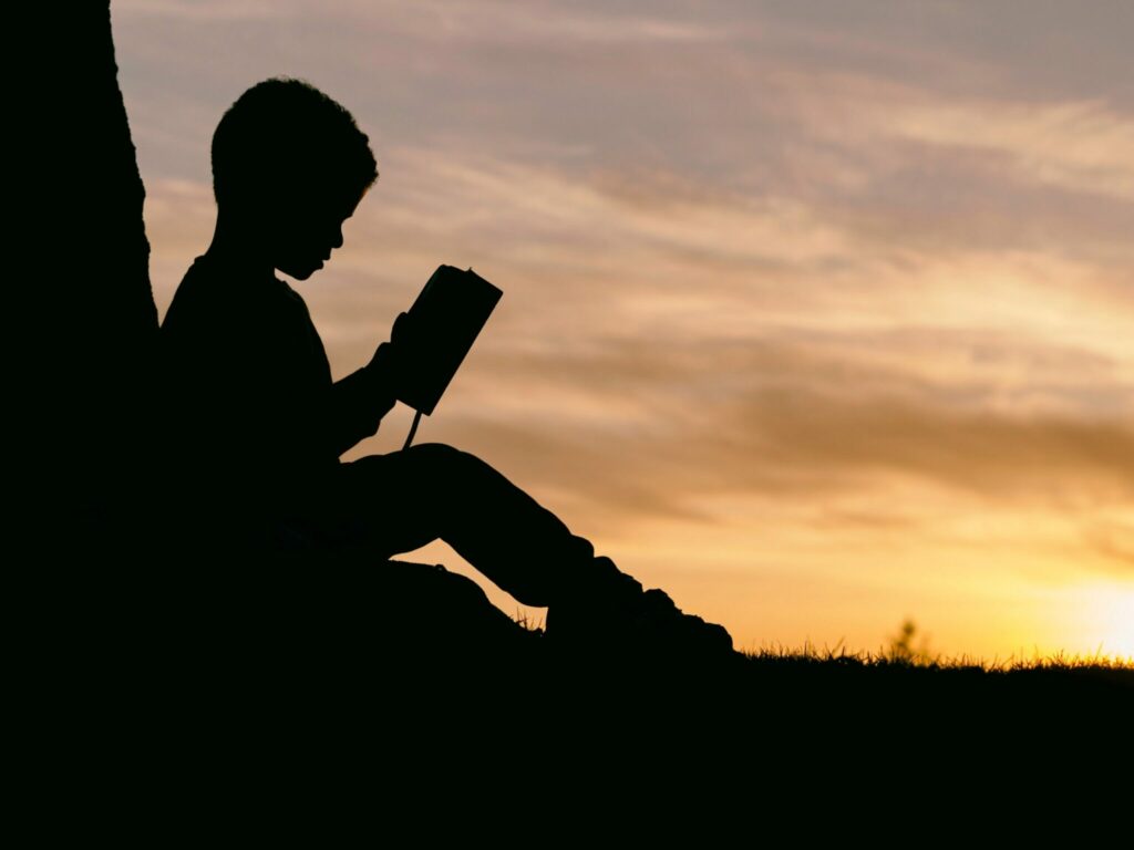 Silhouette of a child on a hill