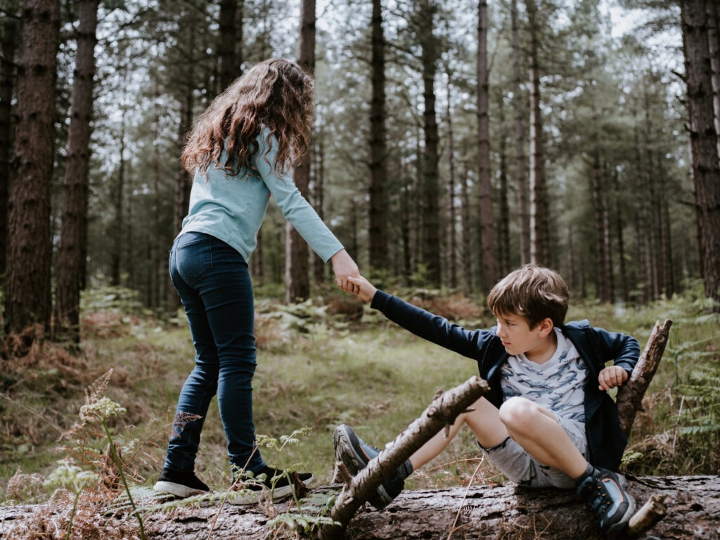 A boy and girl hold hands