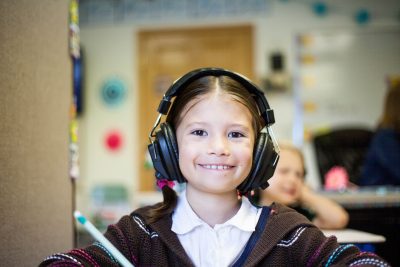 A Girl Wearing a Headset