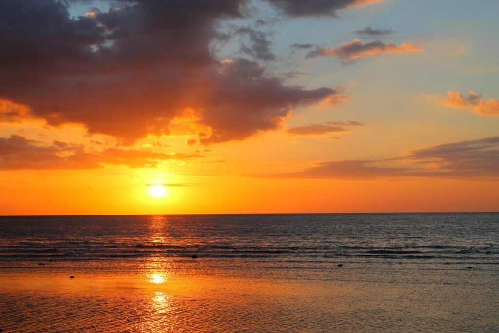 The Sun Sets Over The Ocean